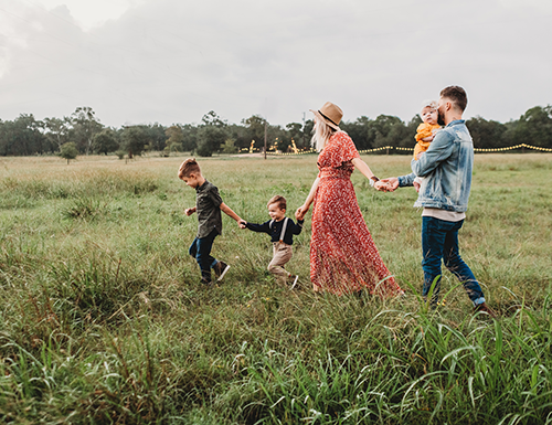 family playing a field